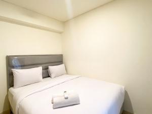 Serene Designed 2BR at Meikarta Apartment By Travelio