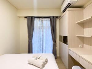 Serene Designed 2BR at Meikarta Apartment By Travelio