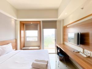 Minimalist and Homey Studio Apartment at Mustika Golf Residence By Travelio