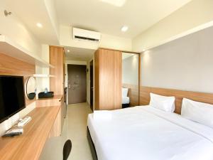 Minimalist and Homey Studio Apartment at Mustika Golf Residence By Travelio