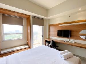 Minimalist and Homey Studio Apartment at Mustika Golf Residence By Travelio