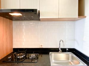 Minimalist and Homey Studio Apartment at Mustika Golf Residence By Travelio