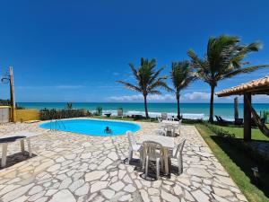 Condomínio Exclusivo à Beira MAR - CASA de 04 quartos com piscina e churrasqueira
