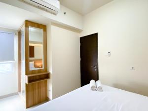 Stunning and Homey 2BR Apartment Mustika Golf Residence By Travelio