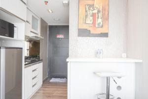 Minimalist and Cozy Studio at Ambassade Kuningan Apartment By Travelio