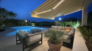 Villas Belle villa calme, piscine, 4 chambres climatisees a 8km de Montpellier classee meuble de tourisme 4 etoiles : photos des chambres