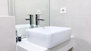 Minimalist and Homey Studio at Daan Mogot City Apartment By Travelio