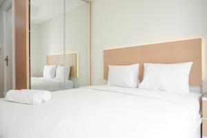 Minimalist and Homey Studio at Daan Mogot City Apartment By Travelio