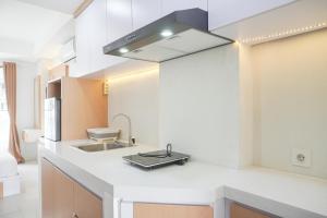 Minimalist and Homey Studio at Daan Mogot City Apartment By Travelio