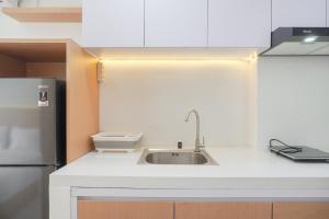 Minimalist and Homey Studio at Daan Mogot City Apartment By Travelio