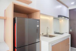 Minimalist and Homey Studio at Daan Mogot City Apartment By Travelio