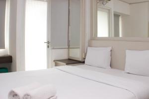 Cozy and Warm Studio at Grand Sentraland Karawang Apartment By Travelio