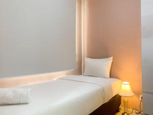 Nice and Strategic 2BR at 16th Floor Daan Mogot City Apartment By Travelio