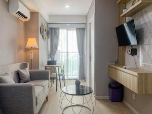 Nice and Strategic 2BR at 16th Floor Daan Mogot City Apartment By Travelio