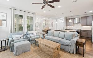 Two Rocking Chairs on a Porch by Oversee 30A