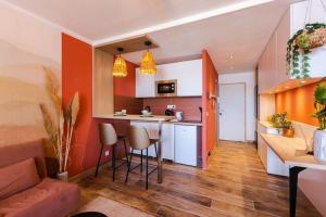 Appartements California - Clim Parking : photos des chambres