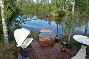 Black house in the forest with Hot Tube and Home theater for movies