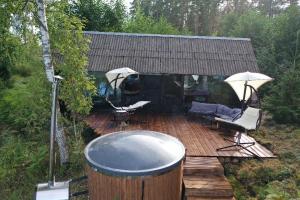 Black house in the forest with Hot Tube and Home theater for movies