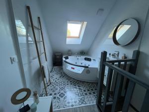 Maisons de vacances LE NID - Charmante petite maison avec balneo : photos des chambres