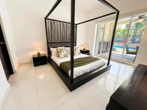 Relax, with our beautiful gardens, large pool and just steps from the beach and lagoon