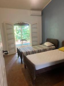 Casa térrea, frente para a Mata e Rio Boiçucanga
