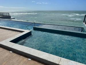 Apartamento térreo com piscina beira mar de Porto de Galinhas