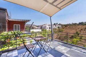 SaffronStays Hobbes - 3BR private pool villa with lawn, family lounge, BBQ nights & deck sit-outs, ideal for celebrations