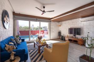 SaffronStays Hobbes - 3BR private pool villa with lawn, family lounge, BBQ nights & deck sit-outs, ideal for celebrations