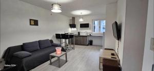 Appartement cosy avec patio en RDC