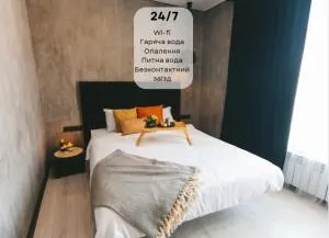 GRAPHITE Затишні апартаменти біля Центру з окремою спальнею і кухнею-вітальнею - 波恰耶夫