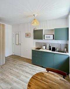 Appartements Une touche de vert : photos des chambres