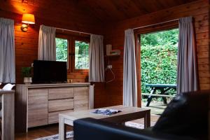 Sfeervol houten huisje met omheinde tuin op de Veluwe