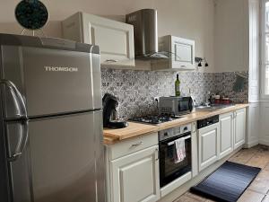 Appartements La Villa Louana charme de l'ancien en coeur de ville : photos des chambres