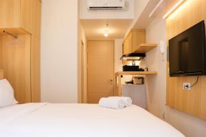 Modern Studio Room at Tokyo Riverside PIK 2 Apartment By Travelio