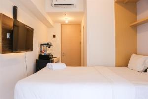 Minimalist and Restful Studio Tokyo Riverside PIK 2 Apartment By Travelio