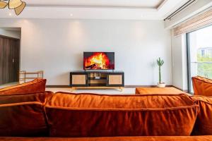 Lush Retreat Near Yaya Center with Pool, Gym & Views