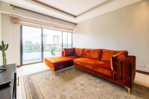 Lush Retreat Near Yaya Center with Pool, Gym & Views