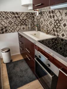 Appartements La maison sous le noyer : photos des chambres
