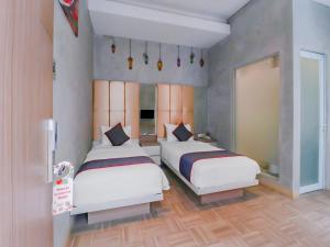 Phòng Hai Giường Đơn Loại Sang (Deluxe Twin Room)
