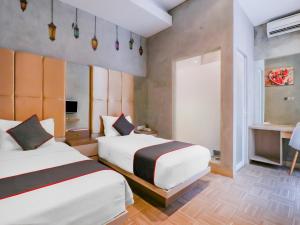Phòng Hai Giường Đơn Loại Sang (Deluxe Twin Room)