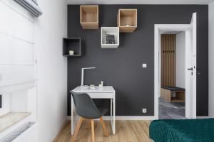 Elegant Apartment in Cracow with Balcony, Parking and Desk by Noclegi Renters