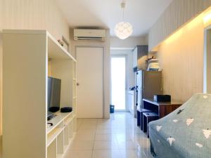 Nice Designed 2BR with Pool View at Green Bay Pluit Apartment By Travelio