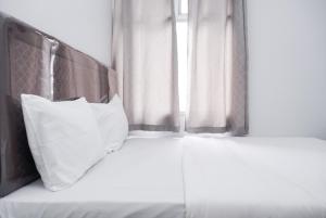 Nice and Simply 2BR at Green Bay Pluit Apartment By Travelio