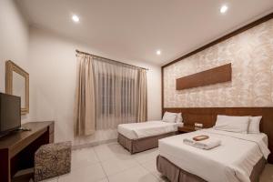 Phòng Hai Giường Đơn Loại Sang (Deluxe Twin Room)