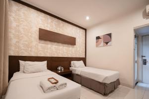 Phòng Hai Giường Đơn Loại Sang (Deluxe Twin Room)
