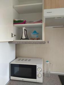 Apartamento con vistas al mar, piscina y wifi