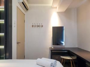 Nice and Cozy Living 2BR Apartment at Green Bay Pluit By Travelio