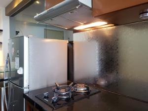 Nice and Cozy Living 2BR Apartment at Green Bay Pluit By Travelio