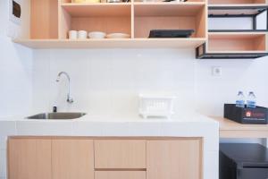 Homey and Simply Studio at Tokyo Riverside PIK 2 Apartment By Travelio