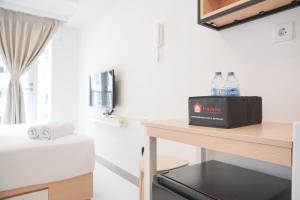 Warm and Simply Studio at Tokyo Riverside PIK 2 Apartment By Travelio